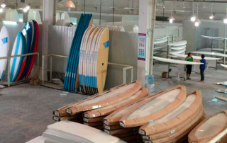 Packaging surfboards on Sunkite surfboards factory
