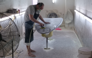 Polishing surfboards on Sunkite surfboards factory